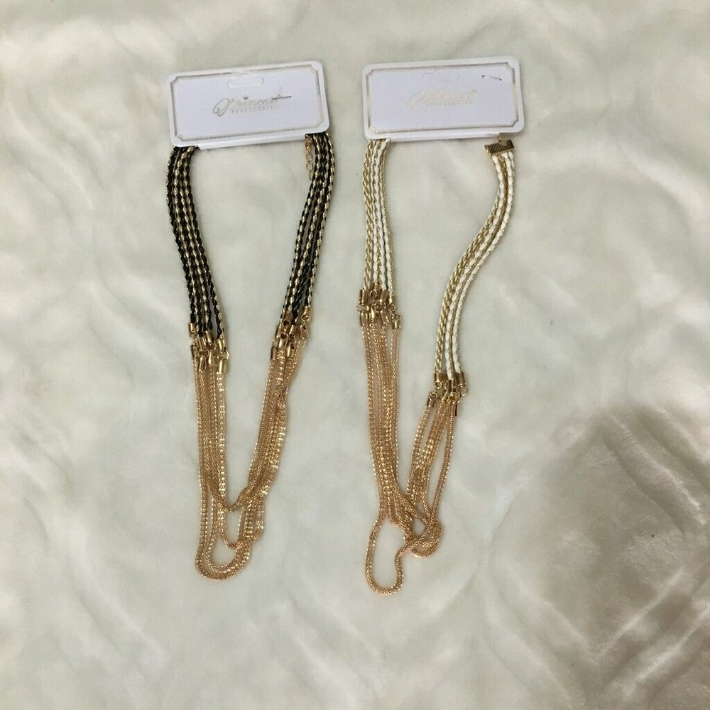Two necklaces  one white & gold /one black & gold